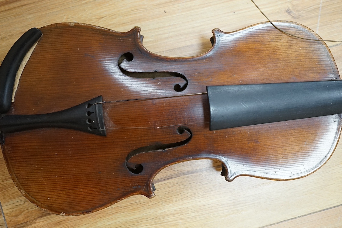 A quarter-size German violin, back measures 31cm. Condition - fair